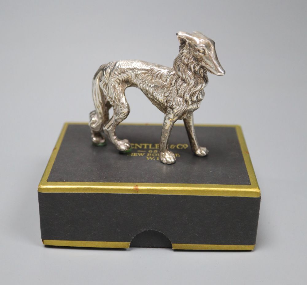 A modern silver model of a dog (filled), height 62mm.